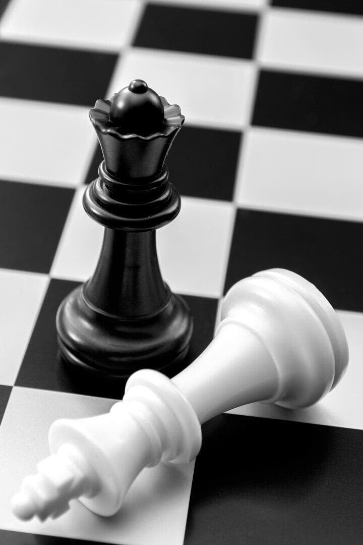 Black Queen puts white king in checkmate in a game of chess